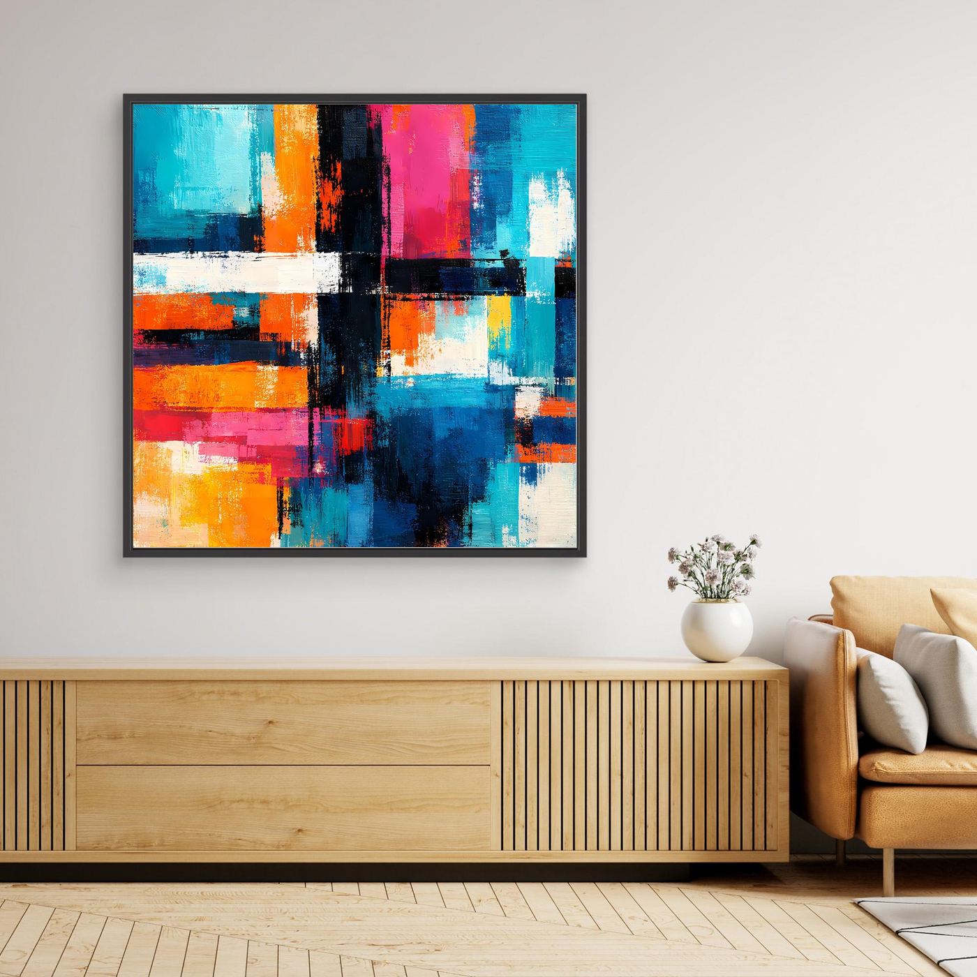Framed abstract geometric canvas art with teal, blue, orange, yellow, pink and black strokes.