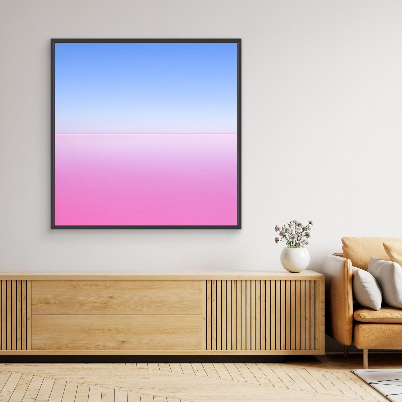Gerahmtes Leinwandbild mit abstraktem Horizont in Pink und Hellblau, schwarzer Rahmen