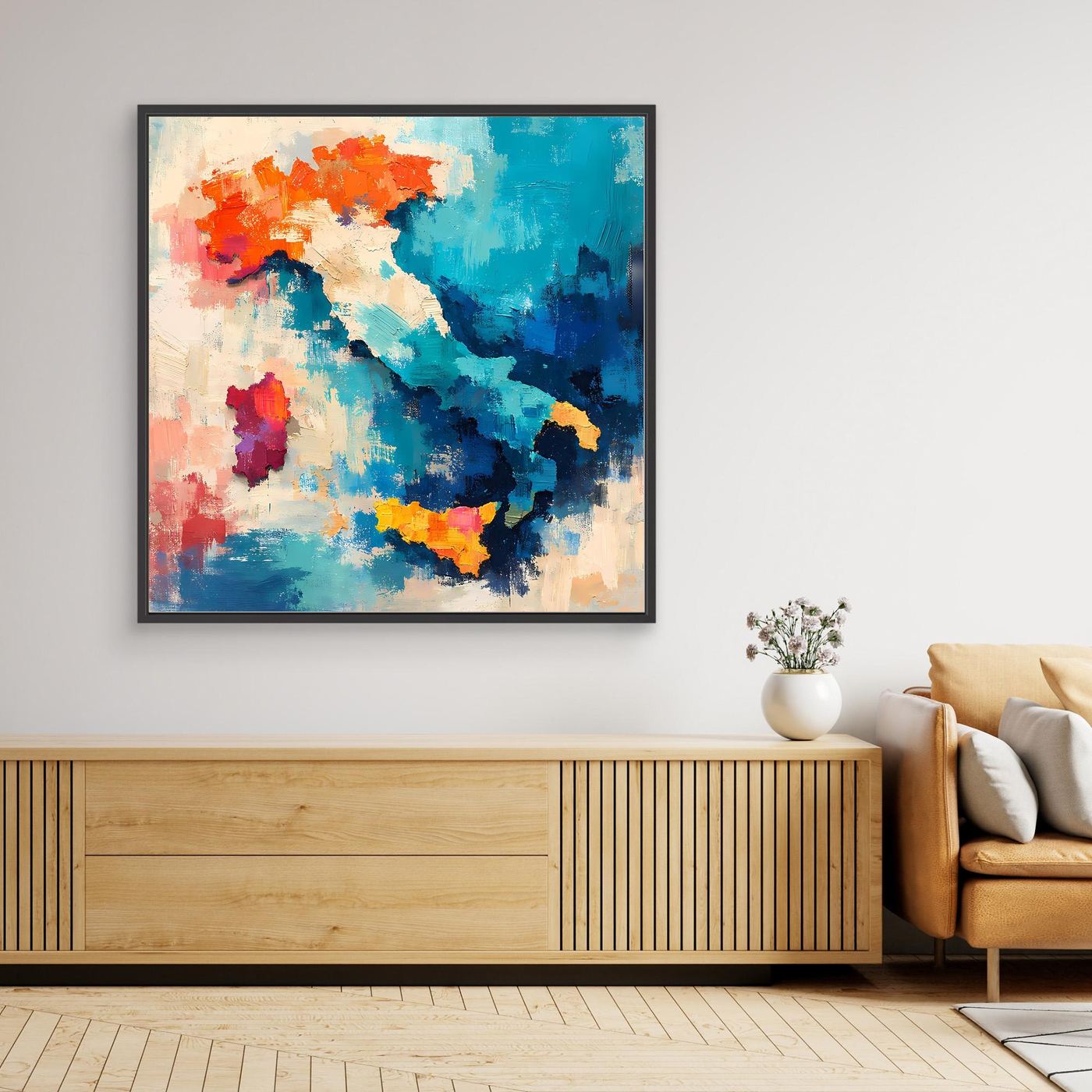 Black framed canvas wall art with colorful abstract map silhouette in blue and orange.