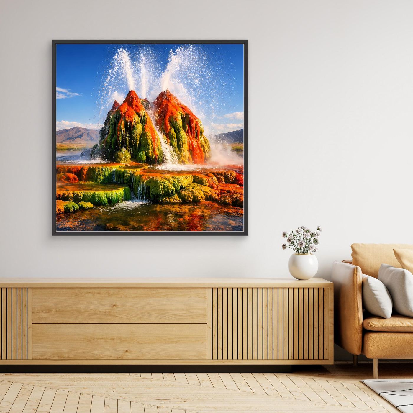 Gerahmtes Leinwandbild mit Geysir-Eruption und farbenfroher Landschaft, schwarzer Rahmen