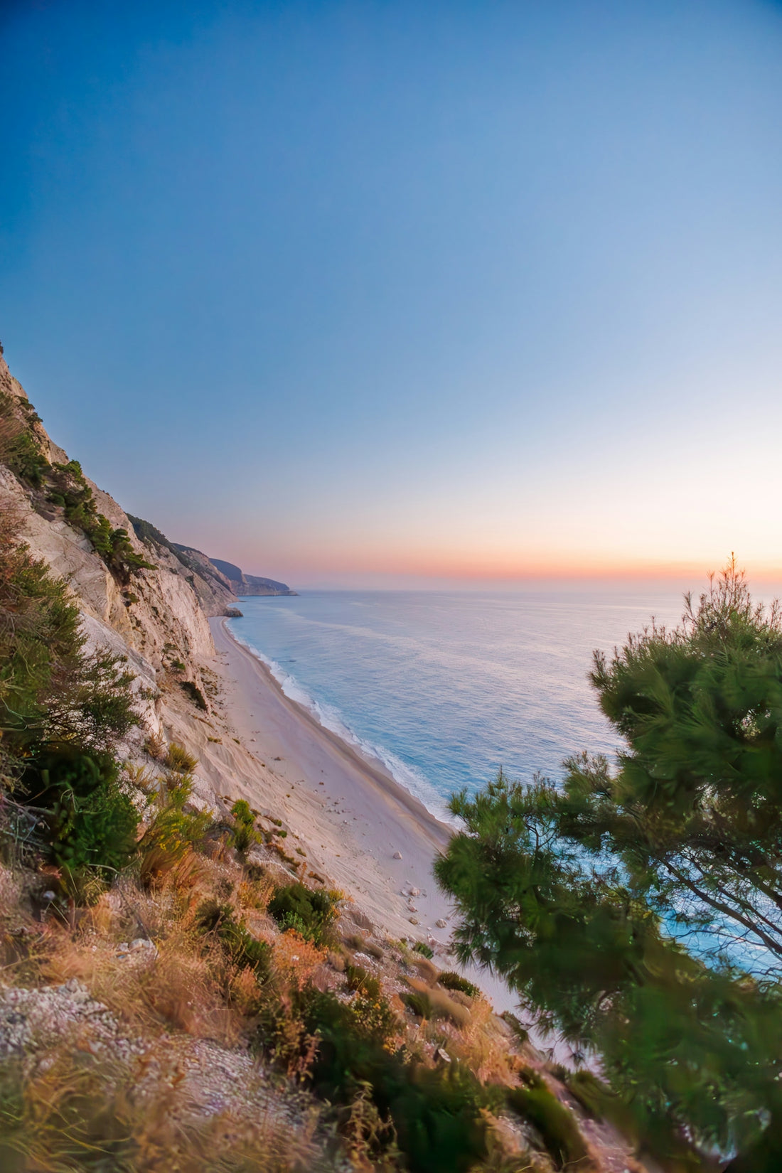a view of a beach from a hill