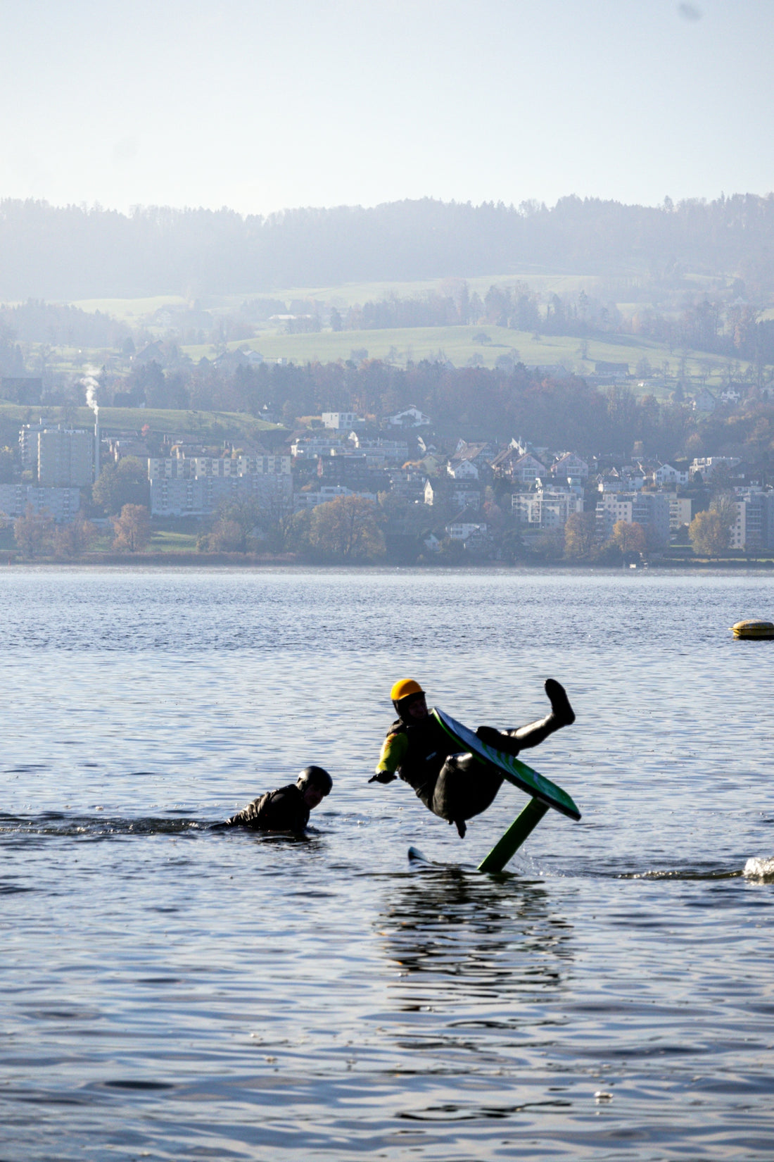 A man riding a surfboard on top of a body of water