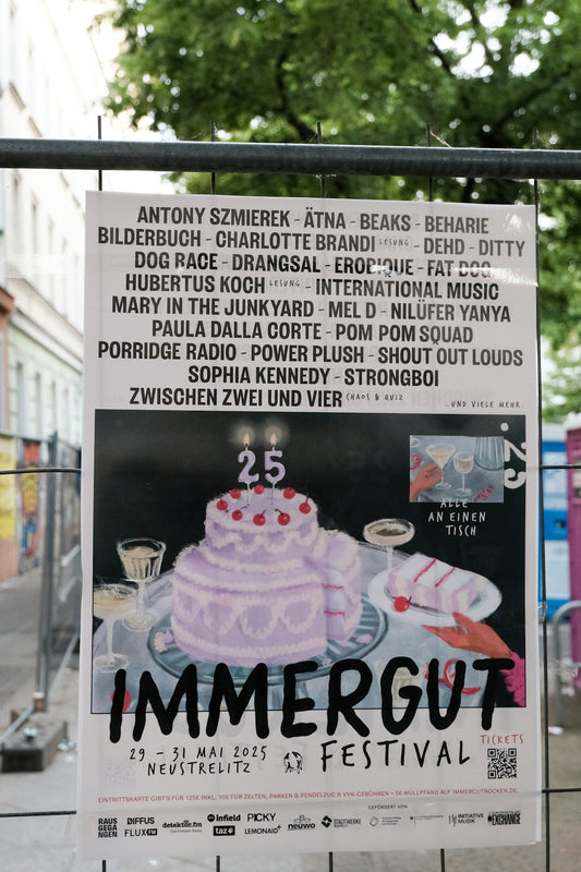 Poster for immergut festival with cake and band names