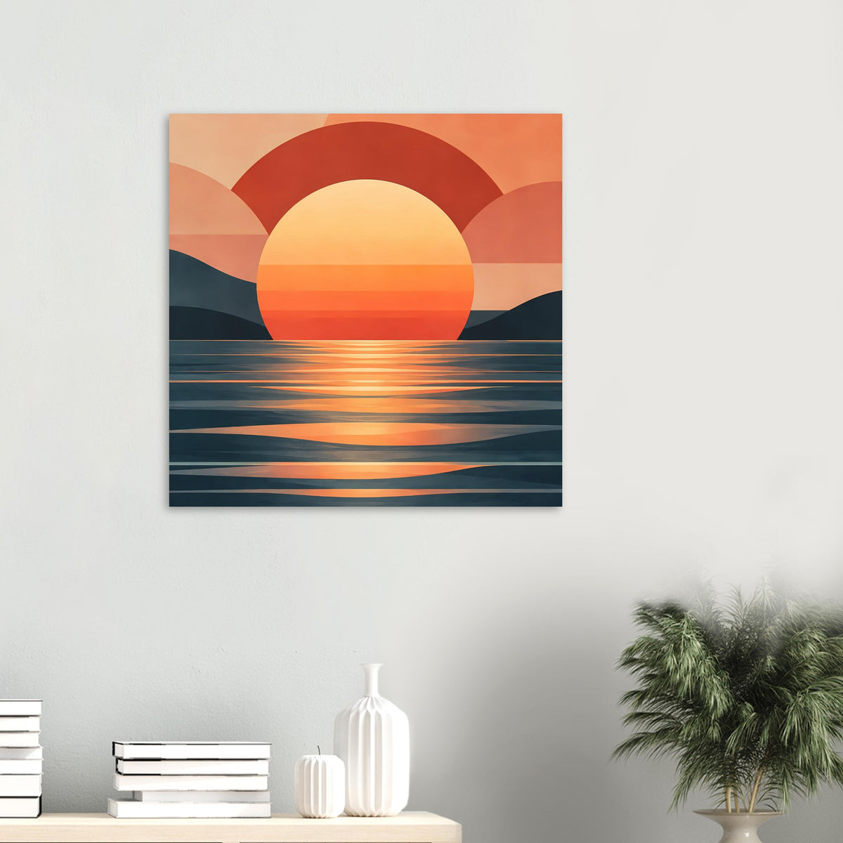 Kleines Poster an der Wand: runde Sonne, rote Bögen und Meerreflexe in Orange und Dunkelblau.