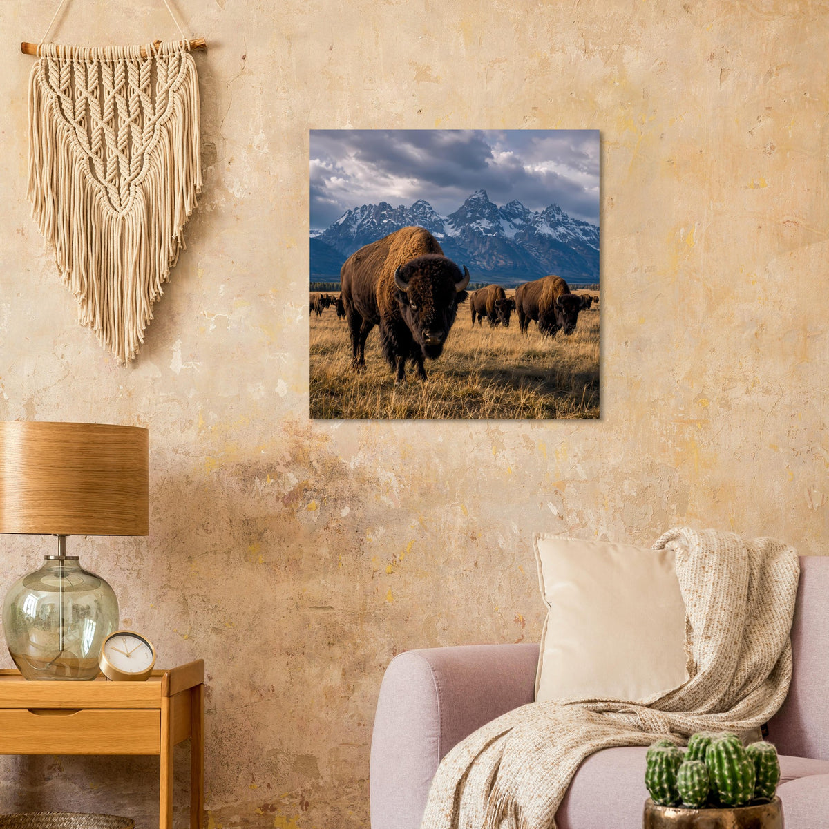 Wandposter mit Büffelherde auf einer Wiese vor dramatischer Berglandschaft