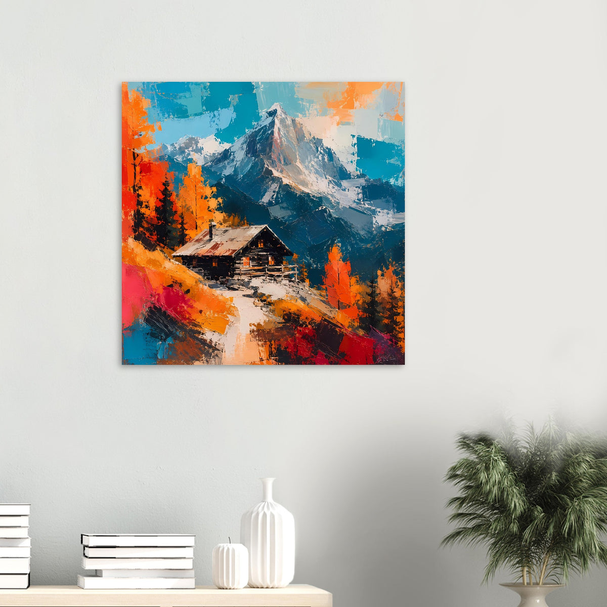 Quadratisches Wandposter mit Berglandschaft und Hütte in leuchtenden Herbstfarben.
