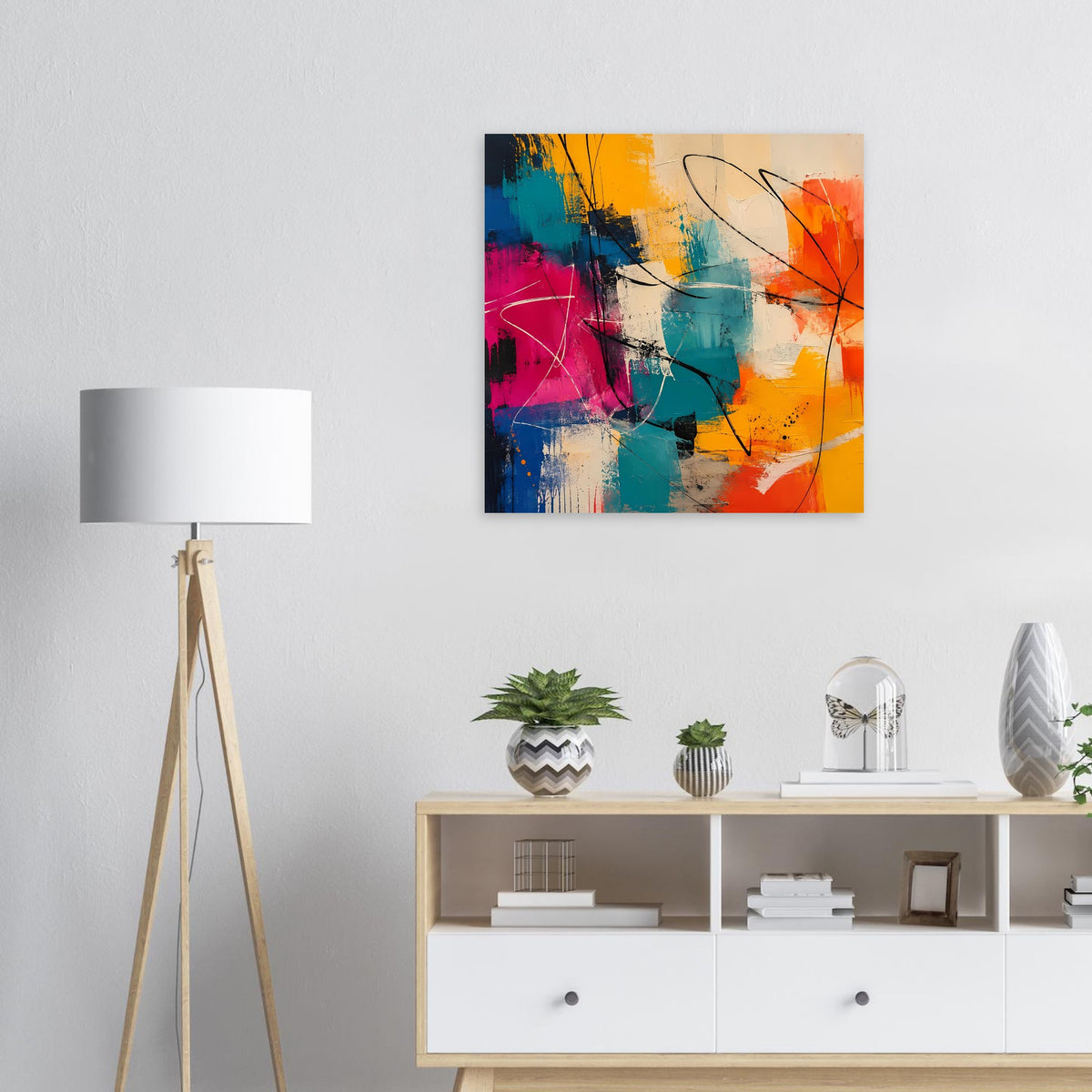 An der Wand hängendes abstraktes Poster mit orange, pinken und blauen Farbflecken