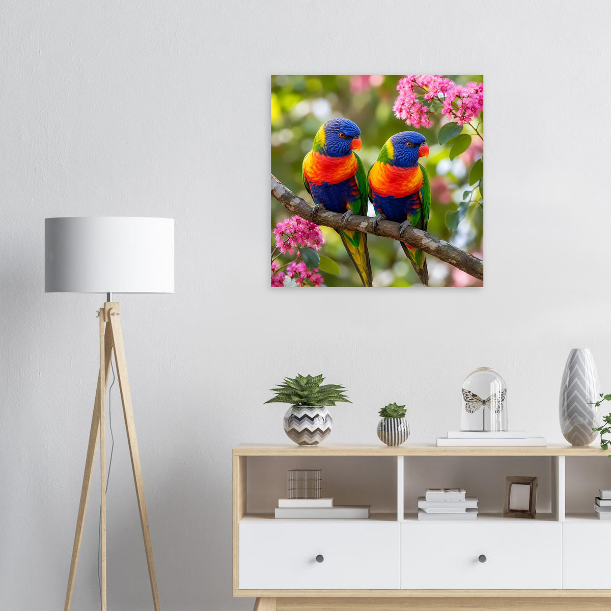 Poster mit zwei Regenbogenloriquets auf einem Ast mit rosa Blüten.