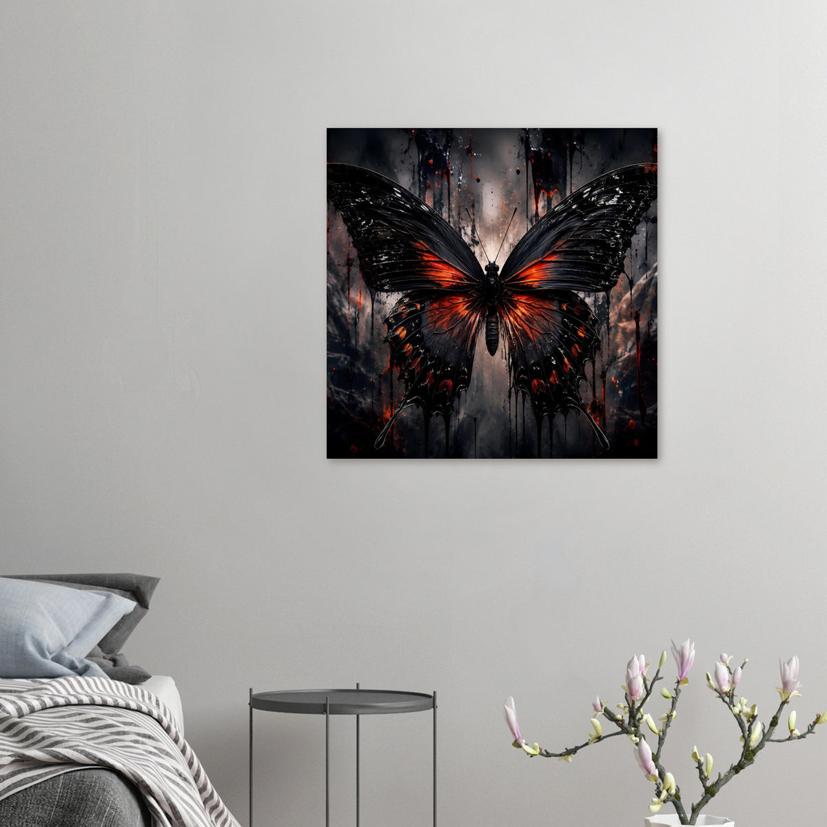 Kleines Schmetterlingsposter: schwarzes Flügelmotiv mit orange-roten Spritzern, mittig