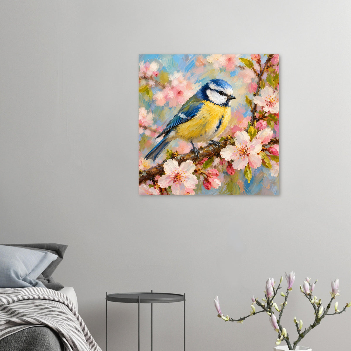 Kleines Vogelpocster im Querformat: blauer und gelber Vogel auf Ast mit rosa Blüten