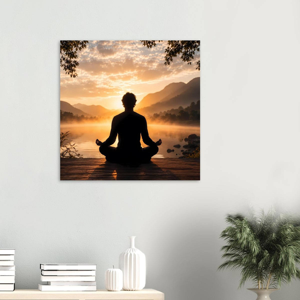 Meditationsposter an der Wand mit Meditationssilhouette und Sonnenaufgang am See