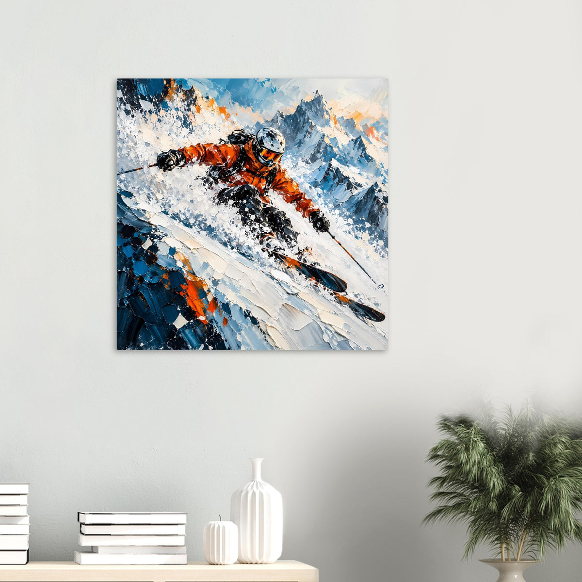 Wintersport-Poster, klein an der Wand: Skifahrer in Orange mit Schneespritzern, blaue Berge