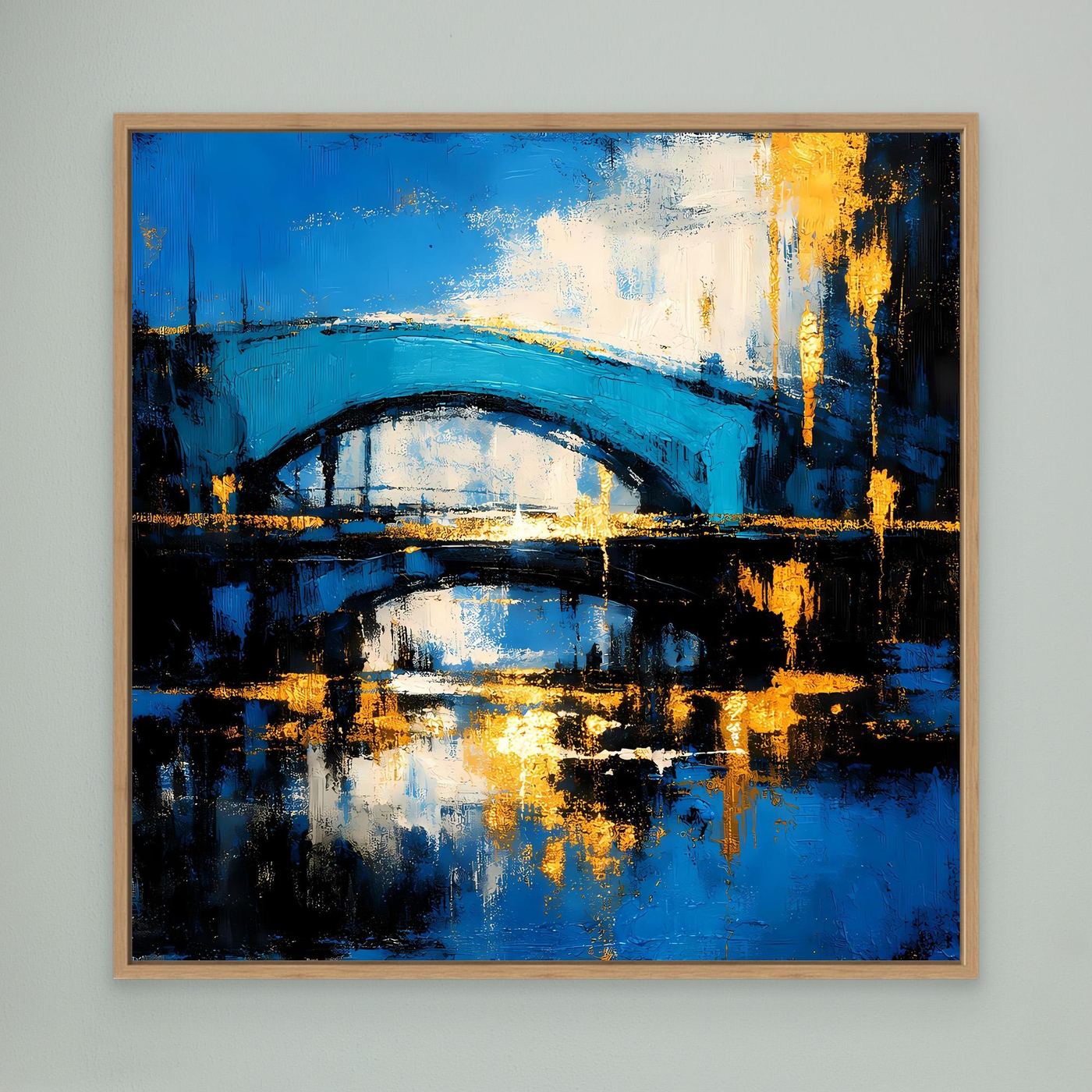 Abstraktes Leinwandbild mit Brücke in Blau und Gold, mit hellem Holzrahmen.