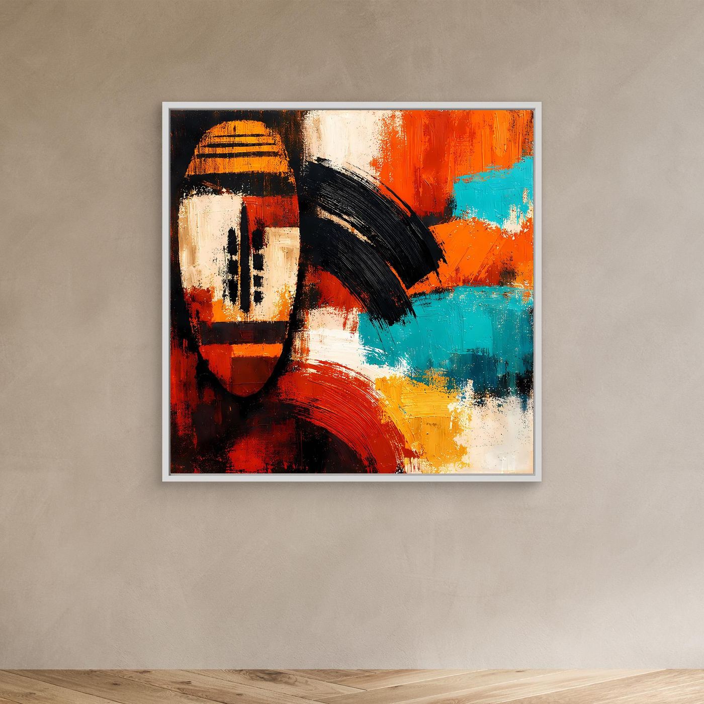 Abstract canvas wall art of an African mask in red, orange, teal and white tones in white frame