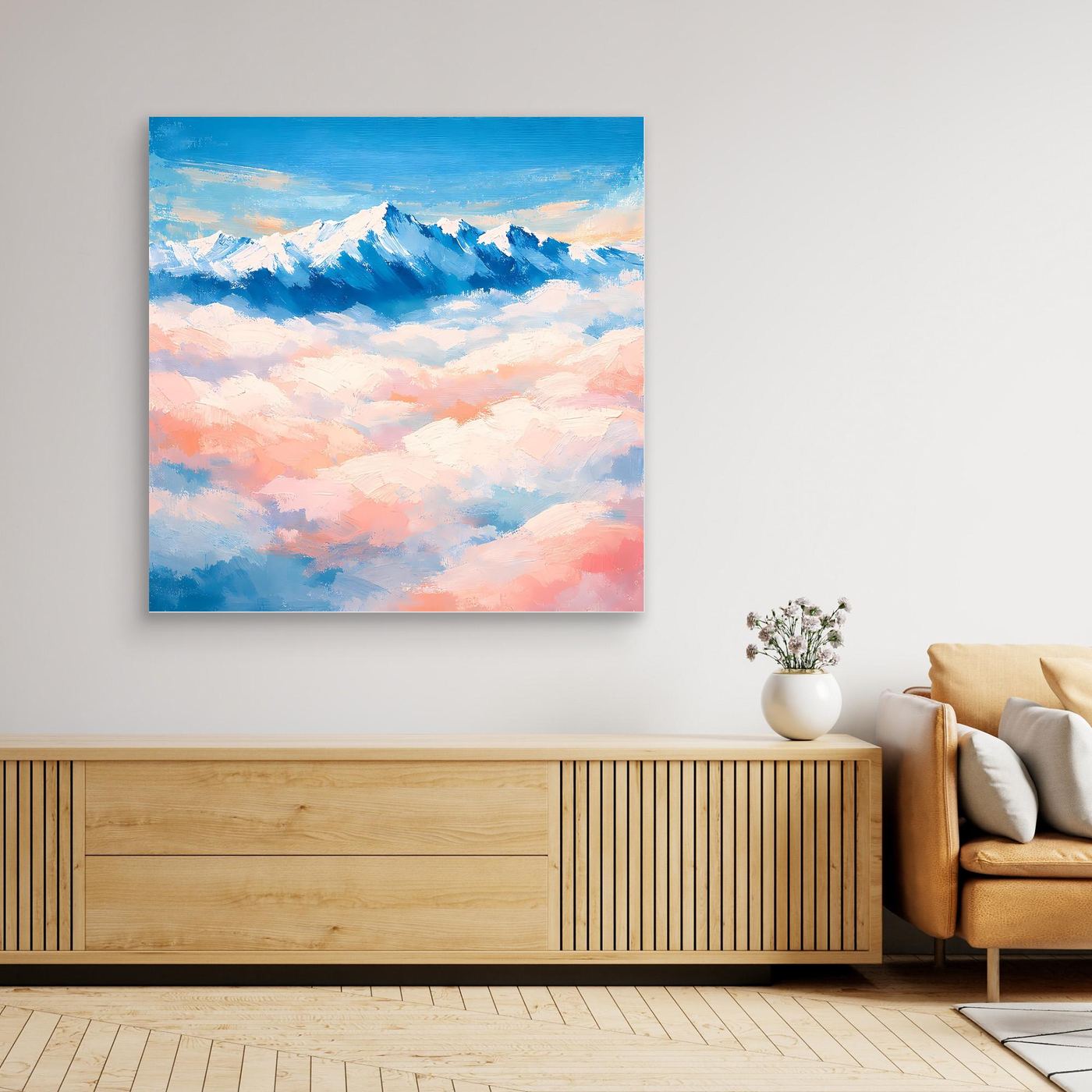 Leinwandbild mit schneebedeckten Berggipfeln über Wolken, in Blau- und Rosatönen
