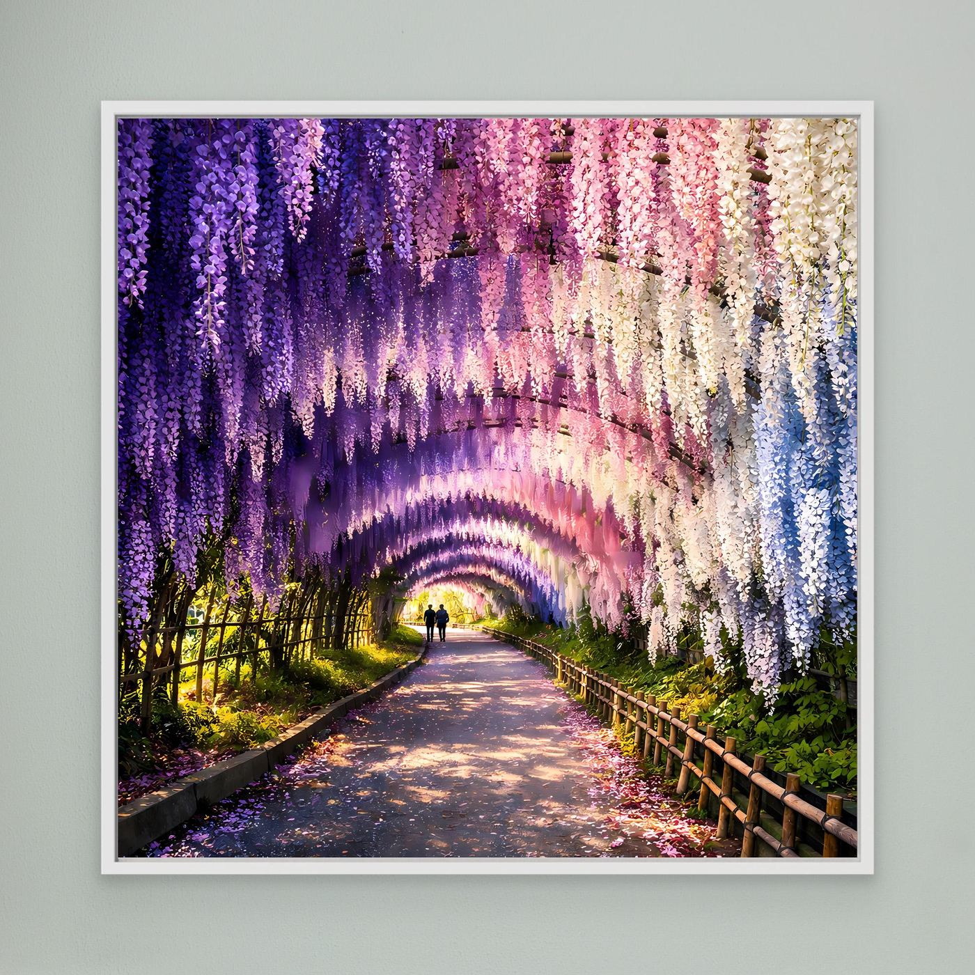 Leinwandbild Wisterientunnel mit lila, rosa und cremefarbenen Blüten, Weg im Bild; weißer Rahmen
