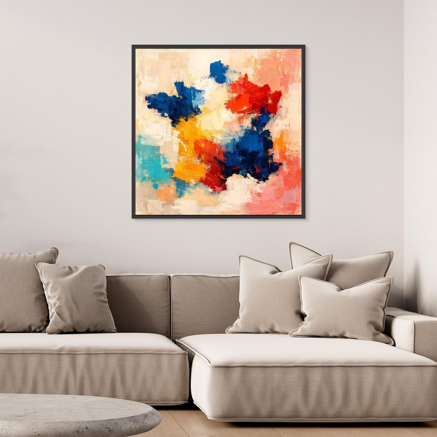Abstract canvas wall art with blue, red, yellow, and teal paint splashes, black frame.