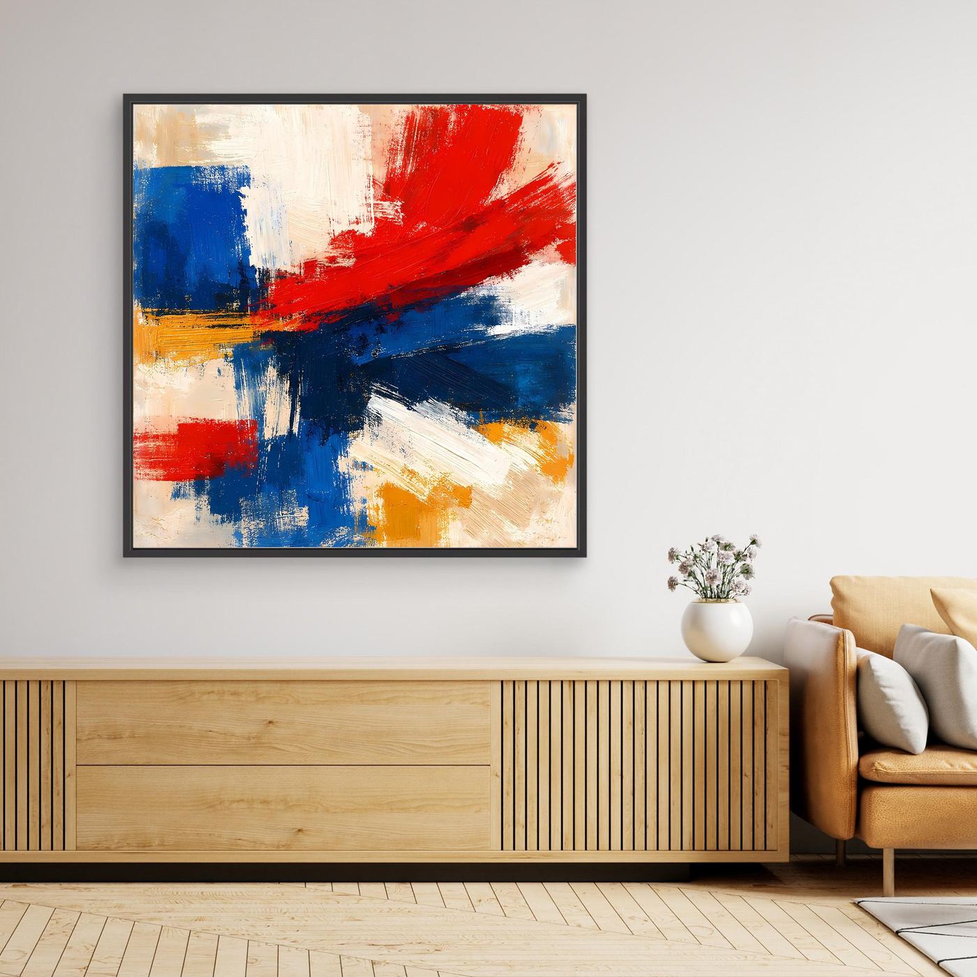 Framed abstract canvas print with bold red, blue, and yellow brushstrokes on light background