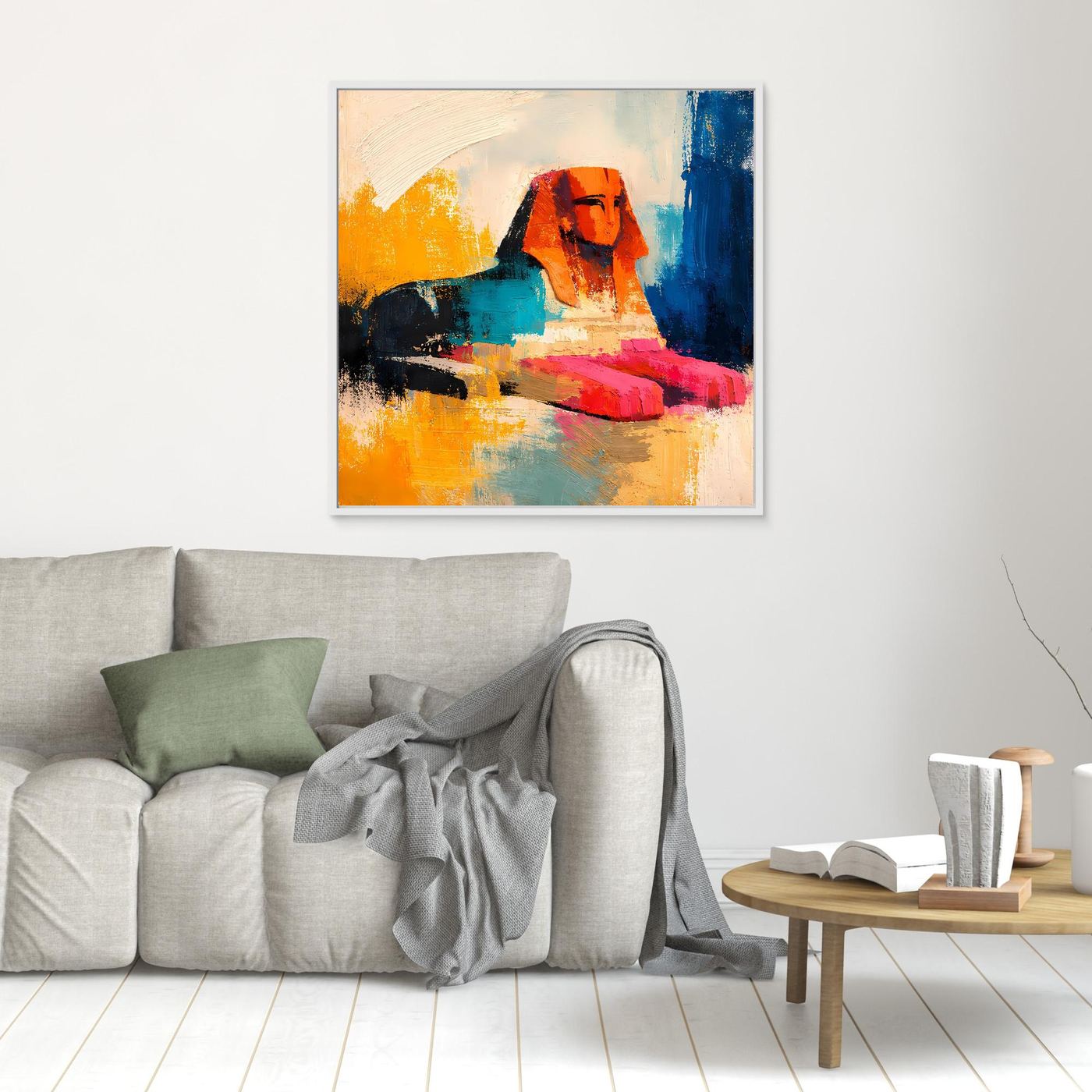 Small abstract sphinx wall art with orange, teal, red, and blue strokes in a light frame