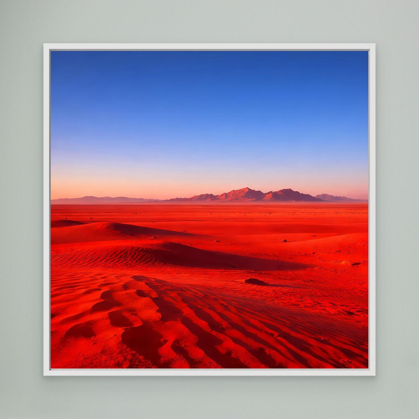 Leinwandbild mit weißem Rahmen, rote Wüste mit Dünen und blauem Himmel