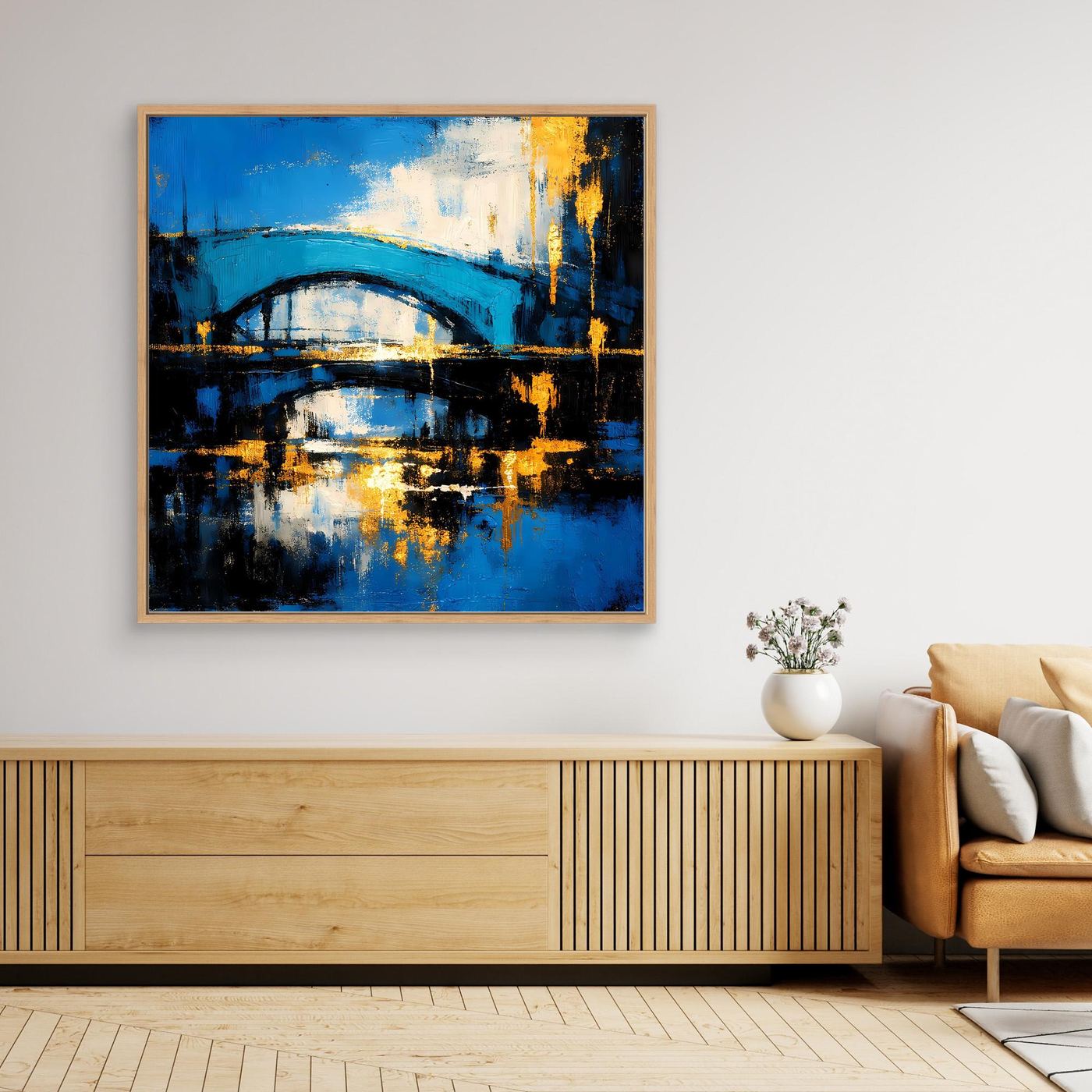 Abstraktes Leinwandbild mit Brücke in Blau und Gold, mit hellem Holzrahmen.