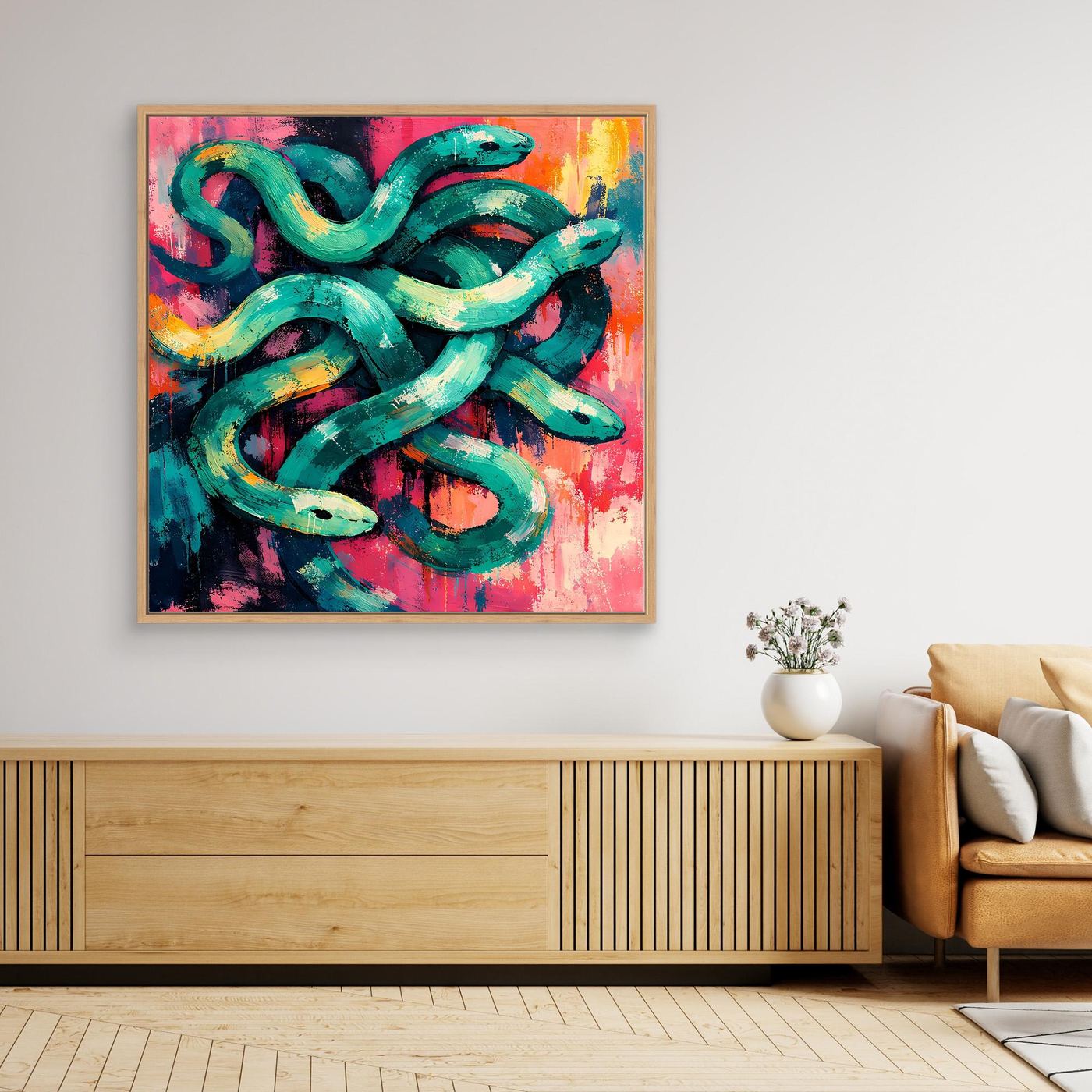 Framed abstract snake wall art canvas with teal, pink, and orange swirling shapes.