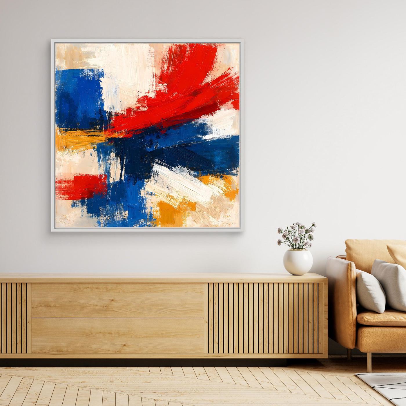 Framed abstract canvas print with bold red, blue, and yellow brushstrokes on light background