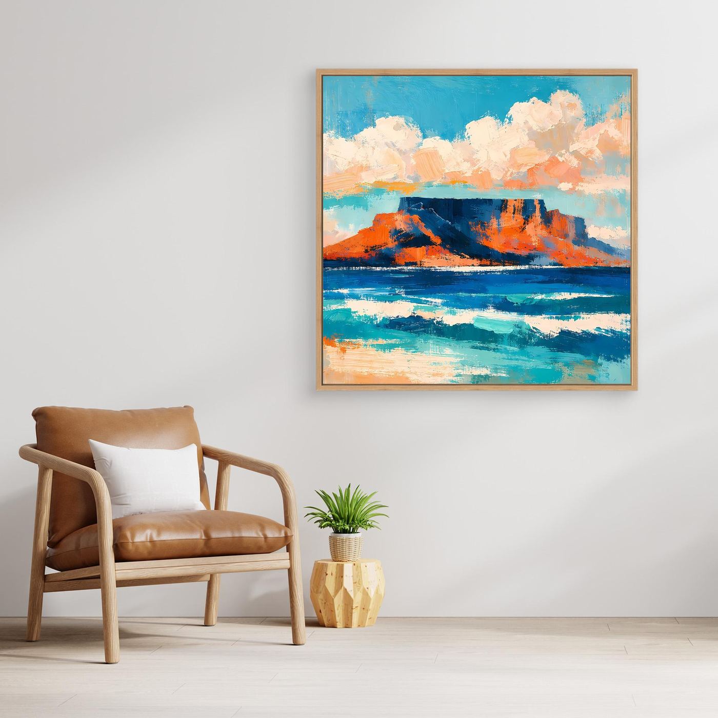 Abstraktes Leinwand-Wandbild mit blauem Meer, orangefarbenen Felsen und Wolken im goldenen Rahmen