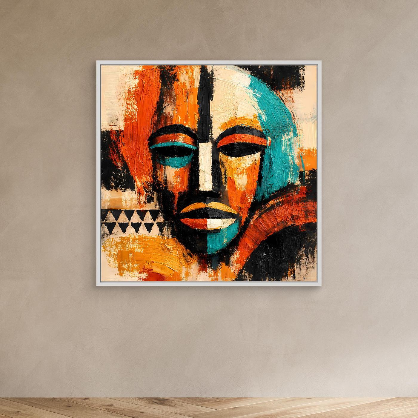 Abstract mask portrait canvas with teal and orange faces and black accents, white frame