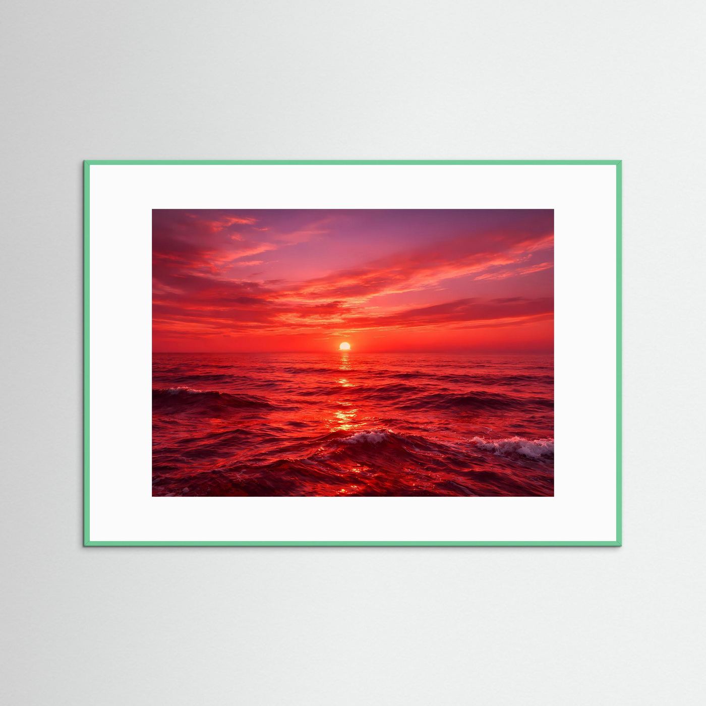 Wandbild mit Sonnenuntergang über dem Meer, im hellgrünen Rahmen