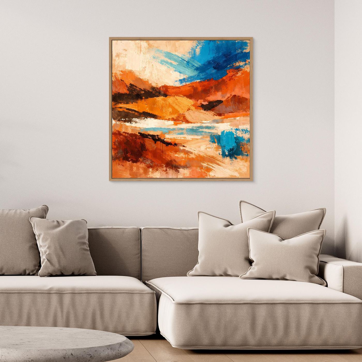 Gerahmtes Leinwandbild mit abstraktem Wüstenmotiv in Orange und Blau, heller Holzrahmen