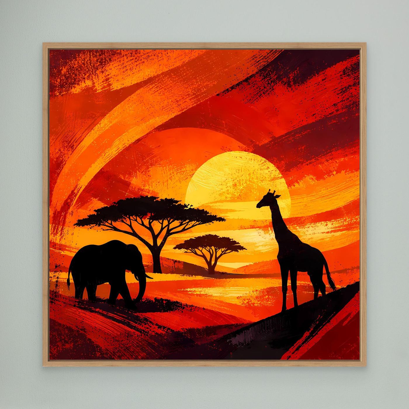 Gerahmtes Leinwandbild im hellem Holzrahmen: Elefant- und Giraffensilhouetten, orange Sonnenuntergang