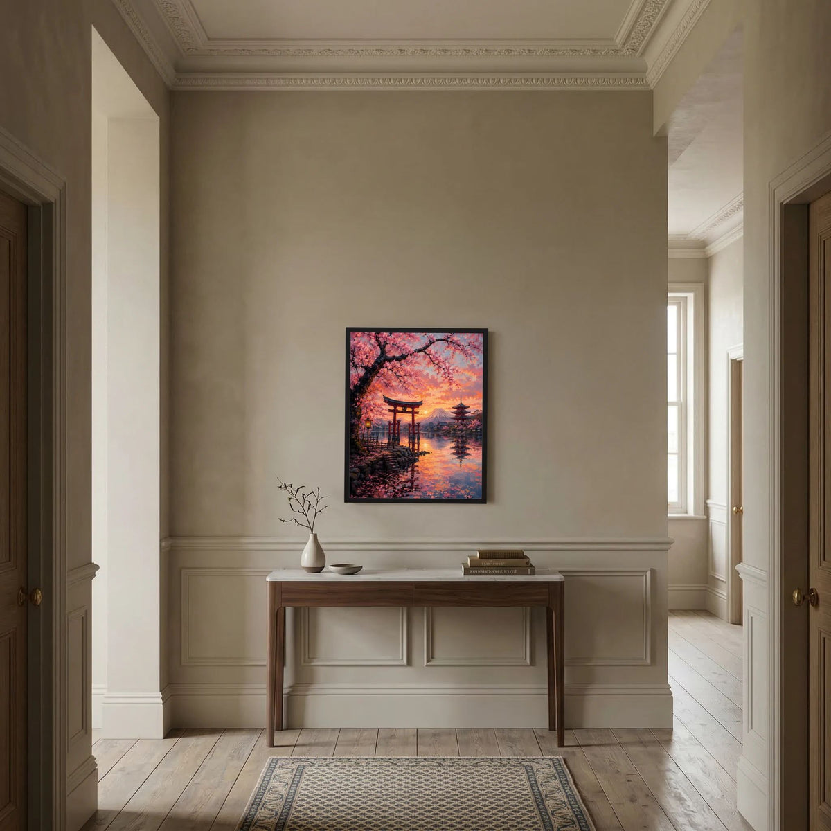 Wandbild im schwarzen Rahmen über einer Konsole: japanische Landschaft mit Torii und Kirschblüten