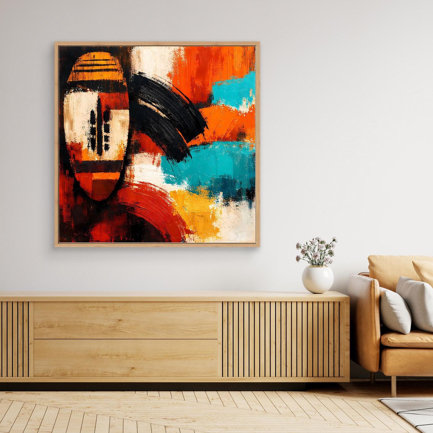 Framed abstract mask wall art featuring orange, turquoise, black and cream brush textures