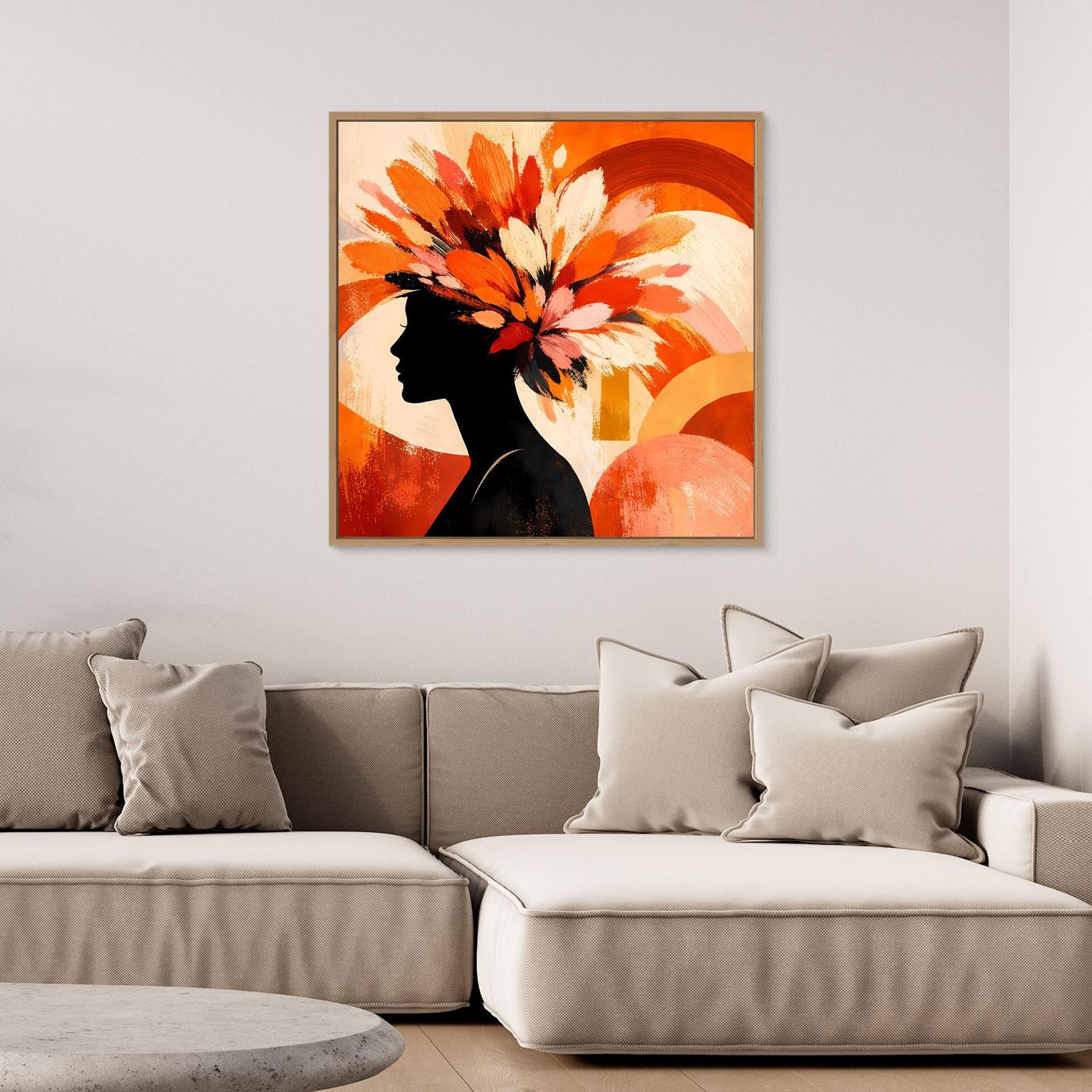 Leinwandbild mit schwarzer Frauen-Silhouette im Profil und bunten Blumen auf warmen Orangetönen, schwarz gerahmt