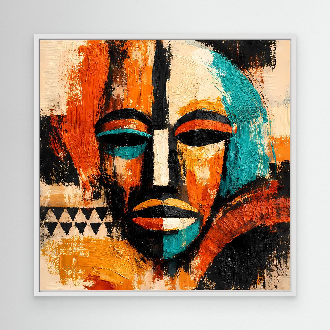 Abstract mask portrait canvas with teal and orange faces and black accents, white frame