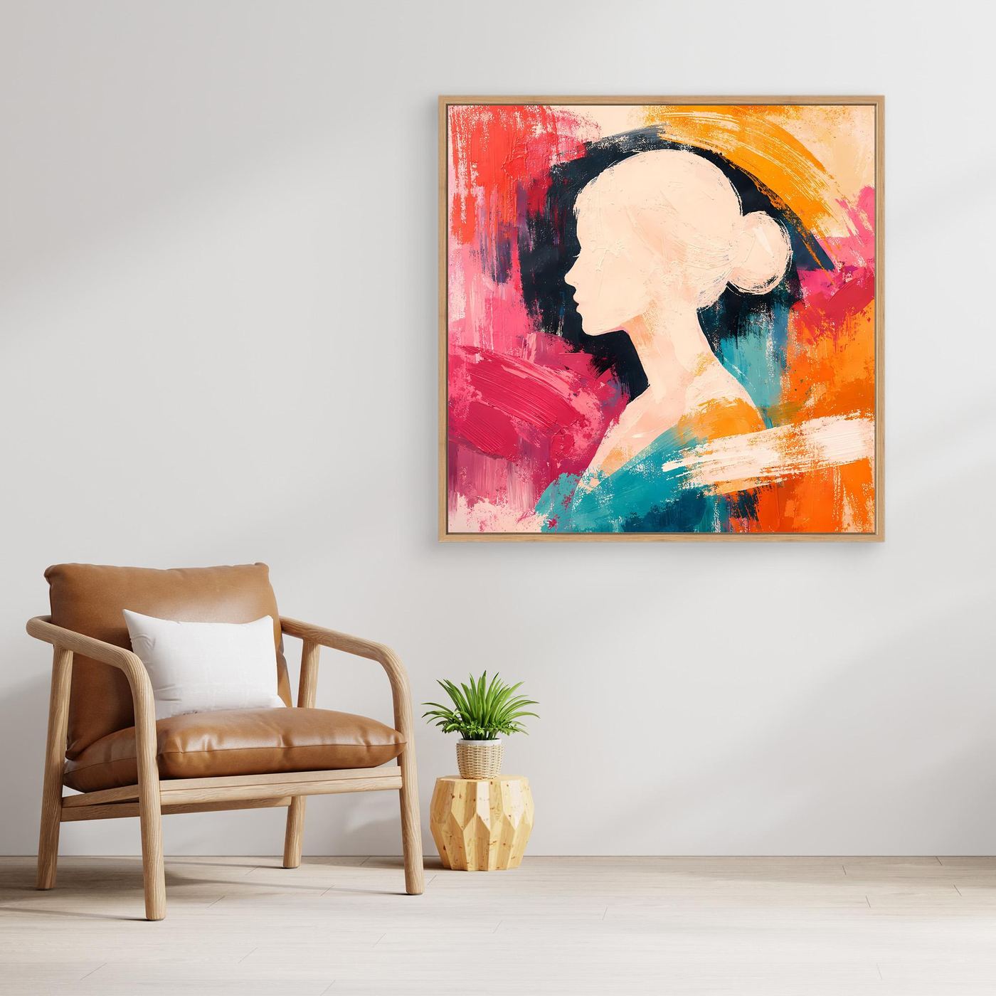 Abstract canvas wall art with woman silhouette in red, orange, teal, and pink, with gold frame.