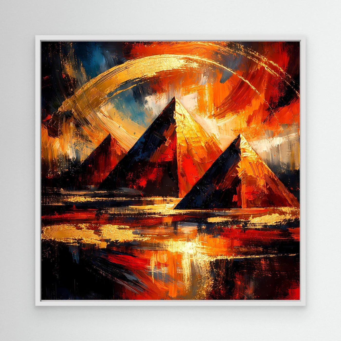 Leinwandbild mit abstrakten Pyramiden in Gold, Orange und Rot, im weißen Rahmen