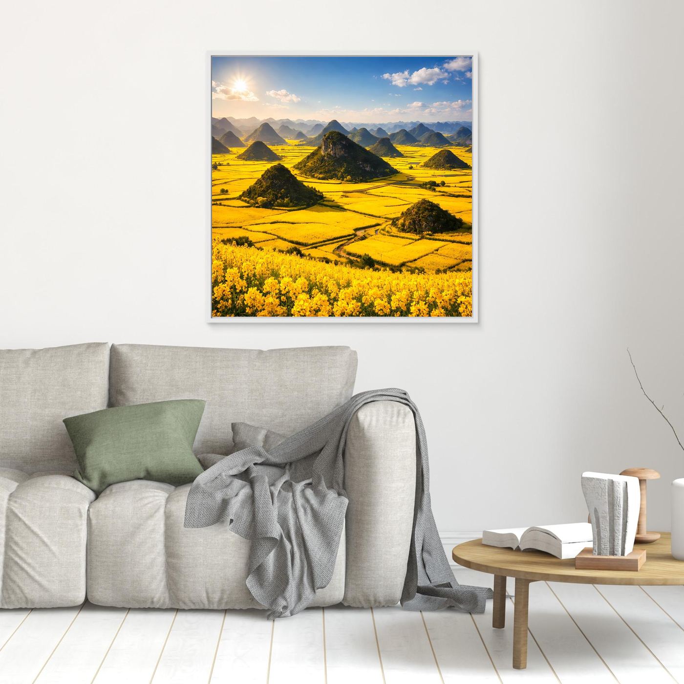 Leinwandbild: goldenes Rapsfeld mit Karstbergen, weiß gerahmt.