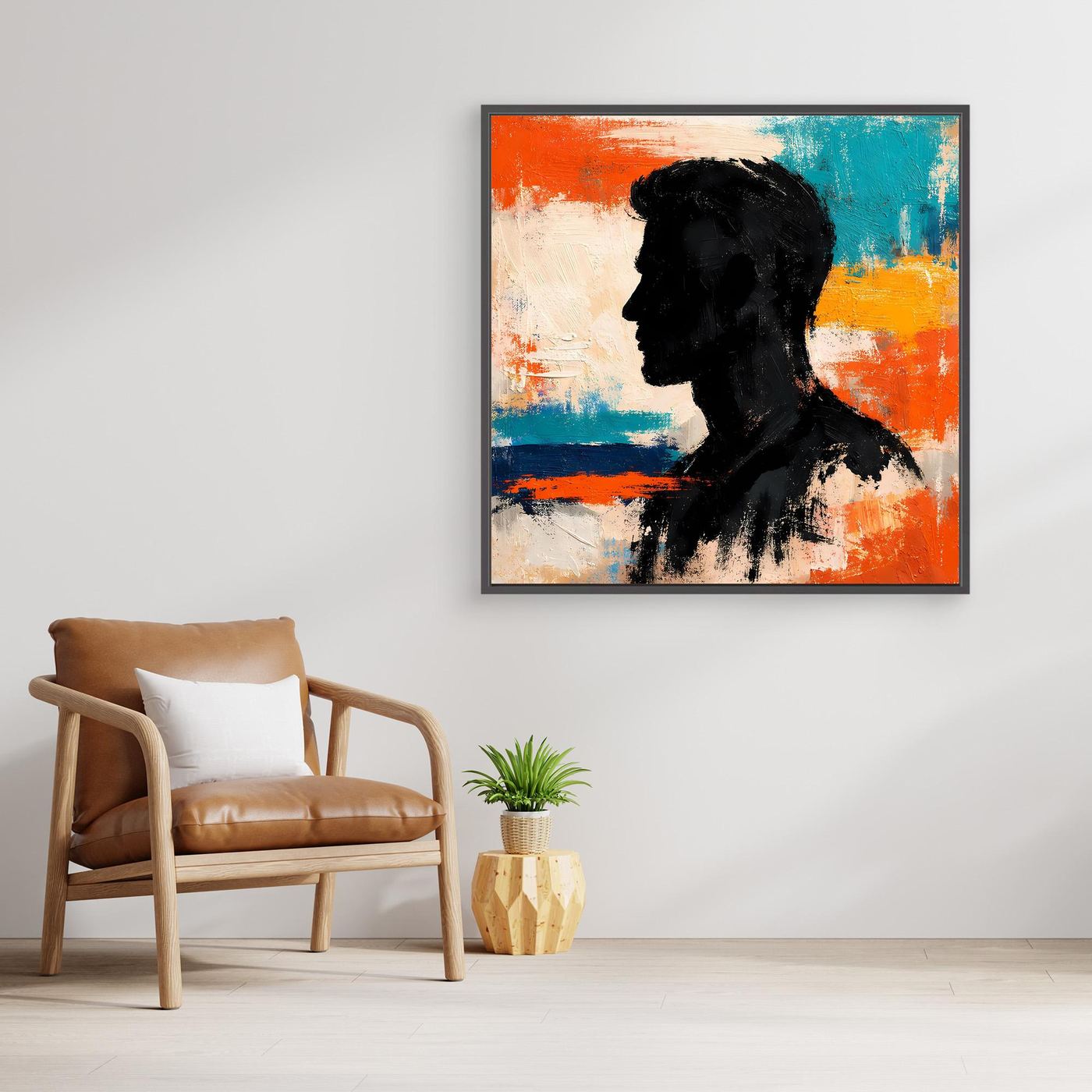 Framed abstract canvas wall art of a male portrait silhouette in black with orange and teal