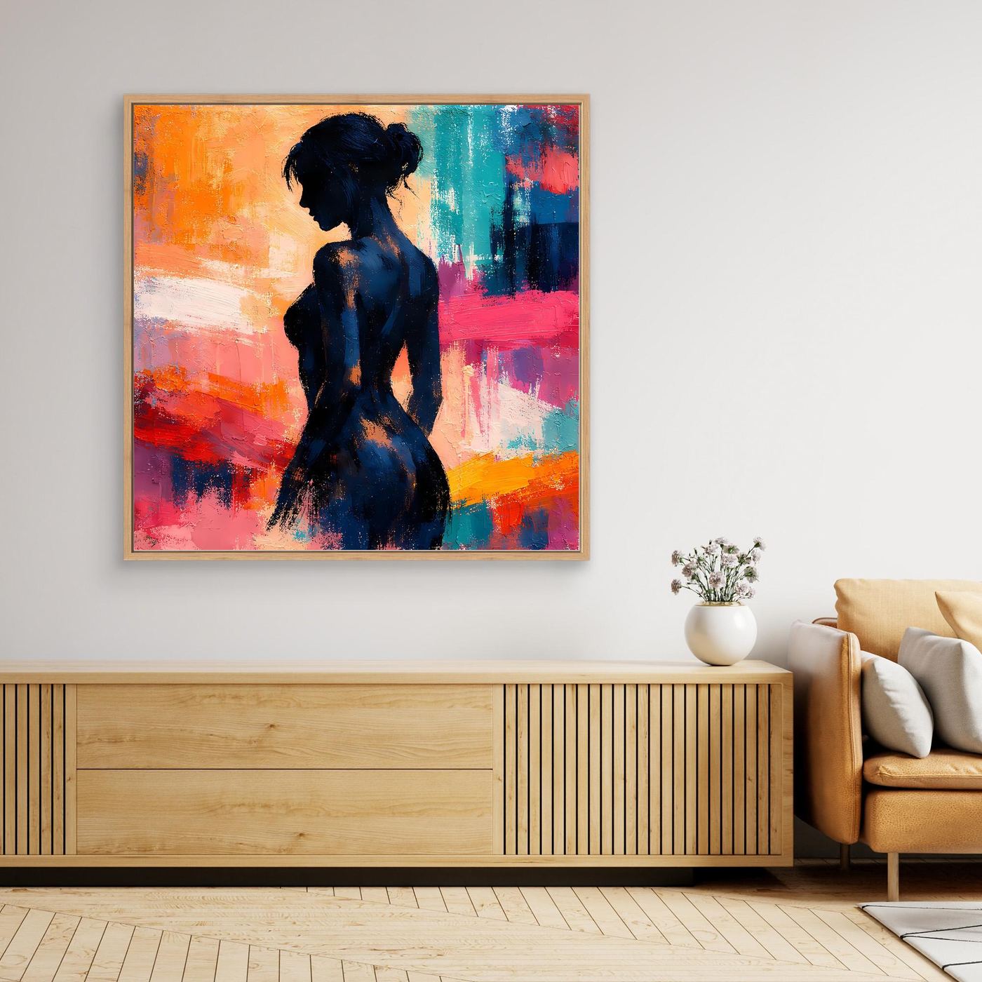 Gerahmtes Leinwand-Wandbild mit abstrakter Frauensilhouette in Blau, Orange und Pink im Profil.