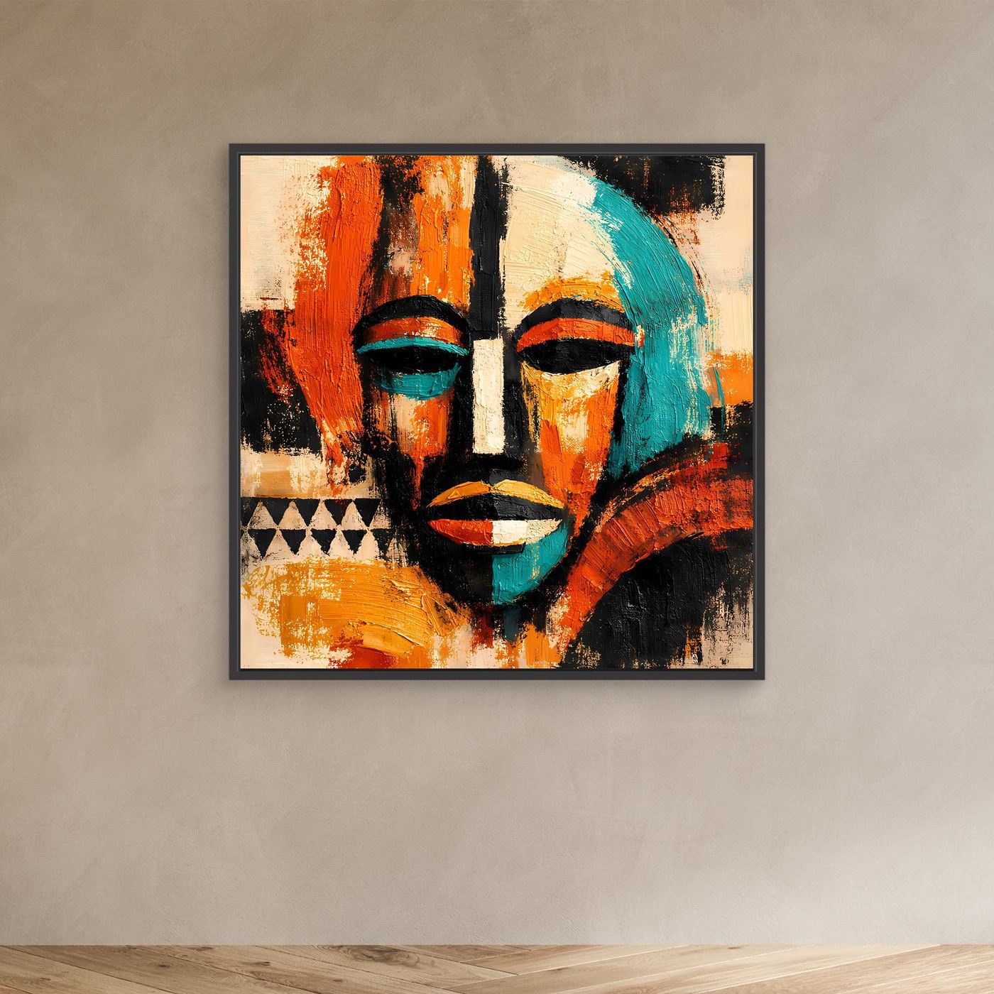 Abstract mask portrait canvas with teal and orange faces and black accents, black frame