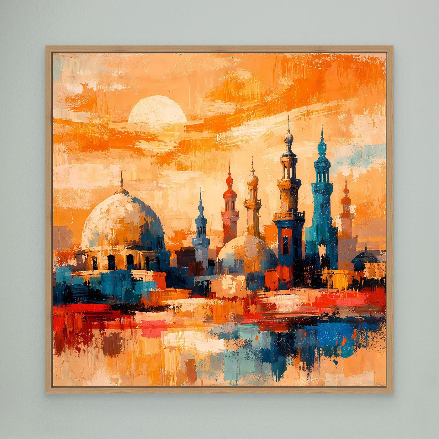Abstraktes Leinwandbild mit orientalischer Skyline und Minaretten, gerahmt in hellem Holz, orange und blau