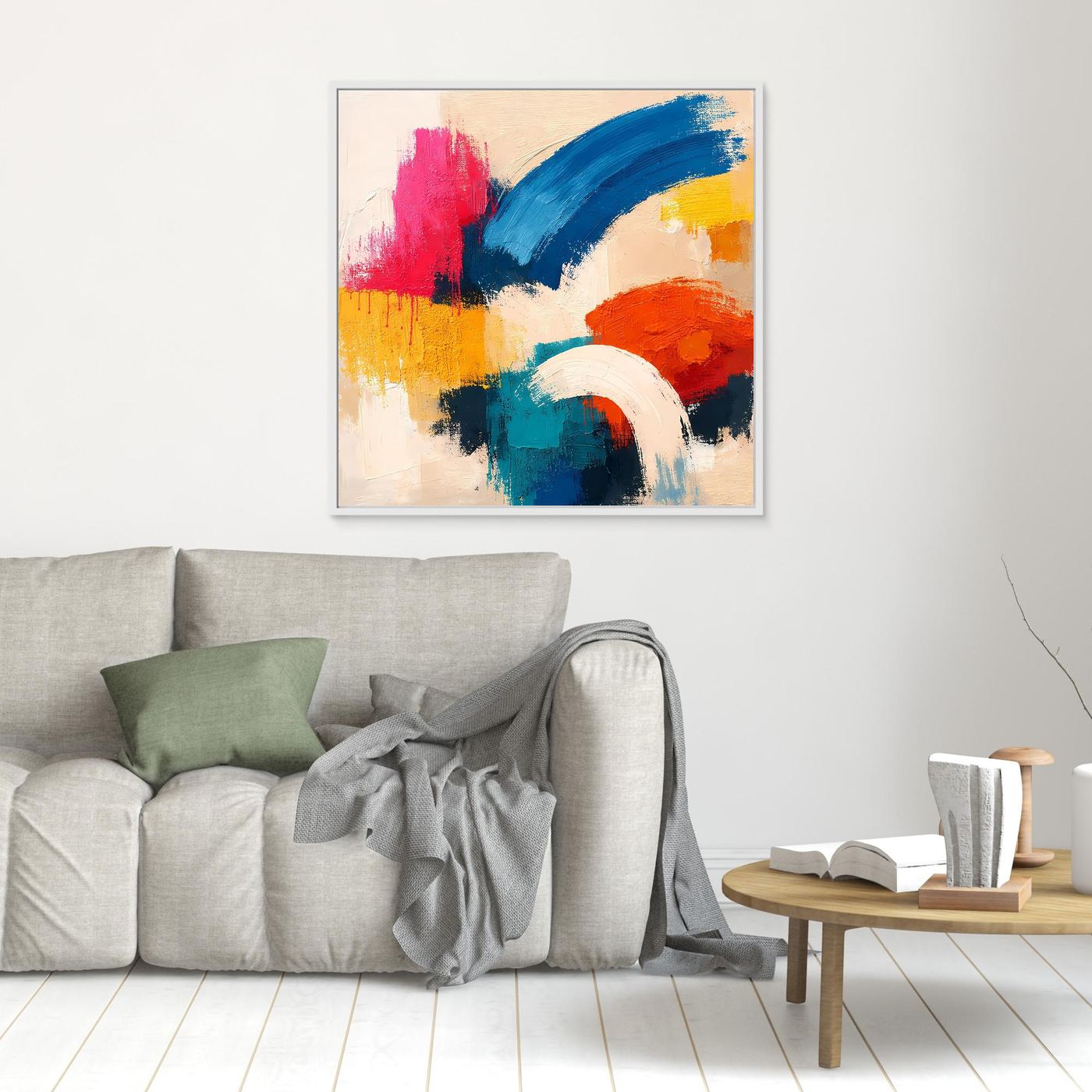 Small abstract canvas painting with blue, pink, red, yellow, and white brushstrokes; white frame.