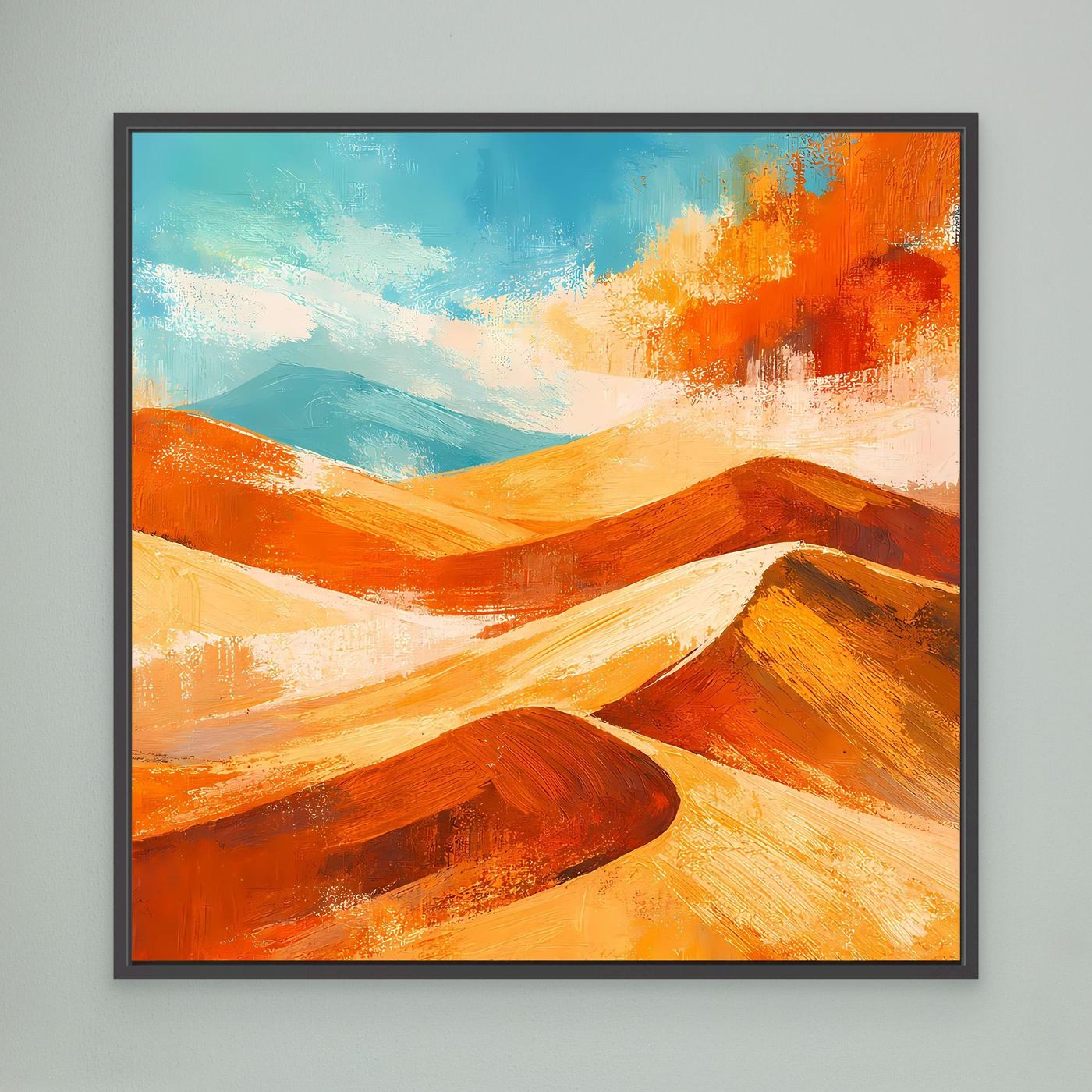 Abstract desert wall art with orange and gold dunes and blue sky; black frame