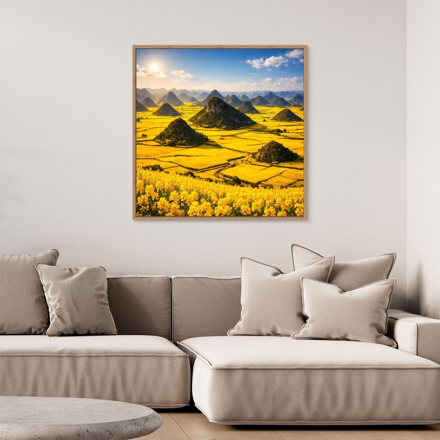 Leinwandbild mit goldenem Rapsfeld und Karstbergen im Eichenrahmen