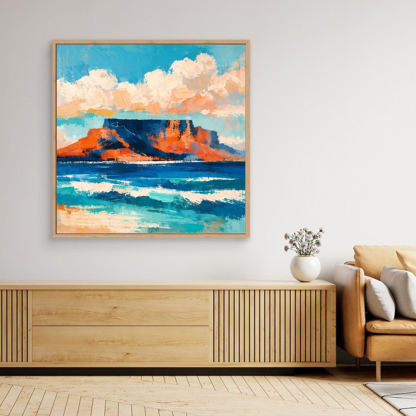 Abstraktes Leinwand-Wandbild mit blauem Meer, orangefarbenen Felsen und Wolken im goldenen Rahmen