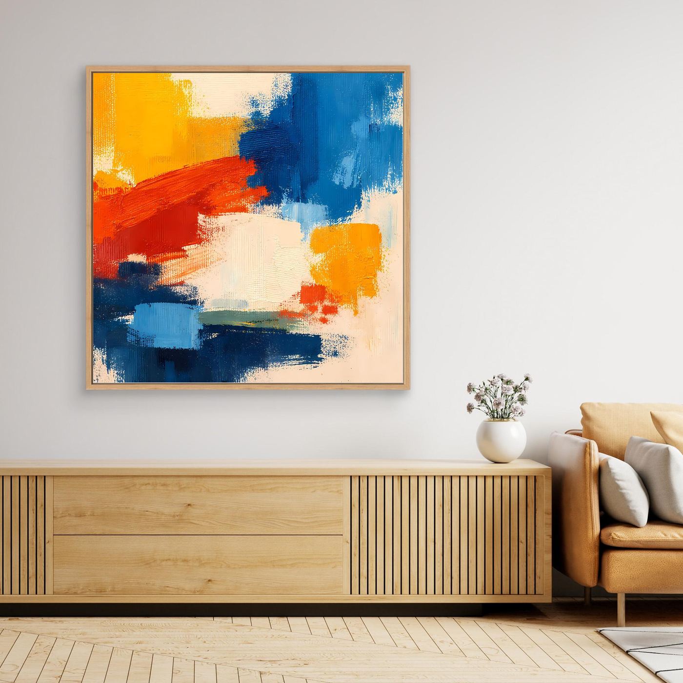 Abstract canvas wall art with light wood frame and bold blue, red, and yellow paint
