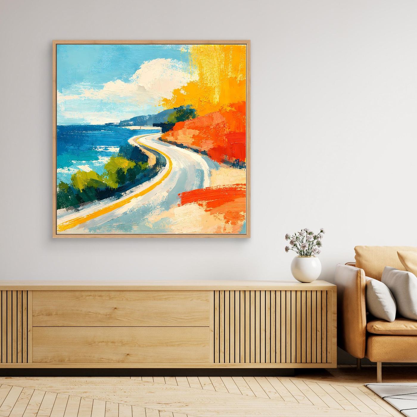 Coastal road abstract wall art with oak frame, blue water and orange coast with winding road.