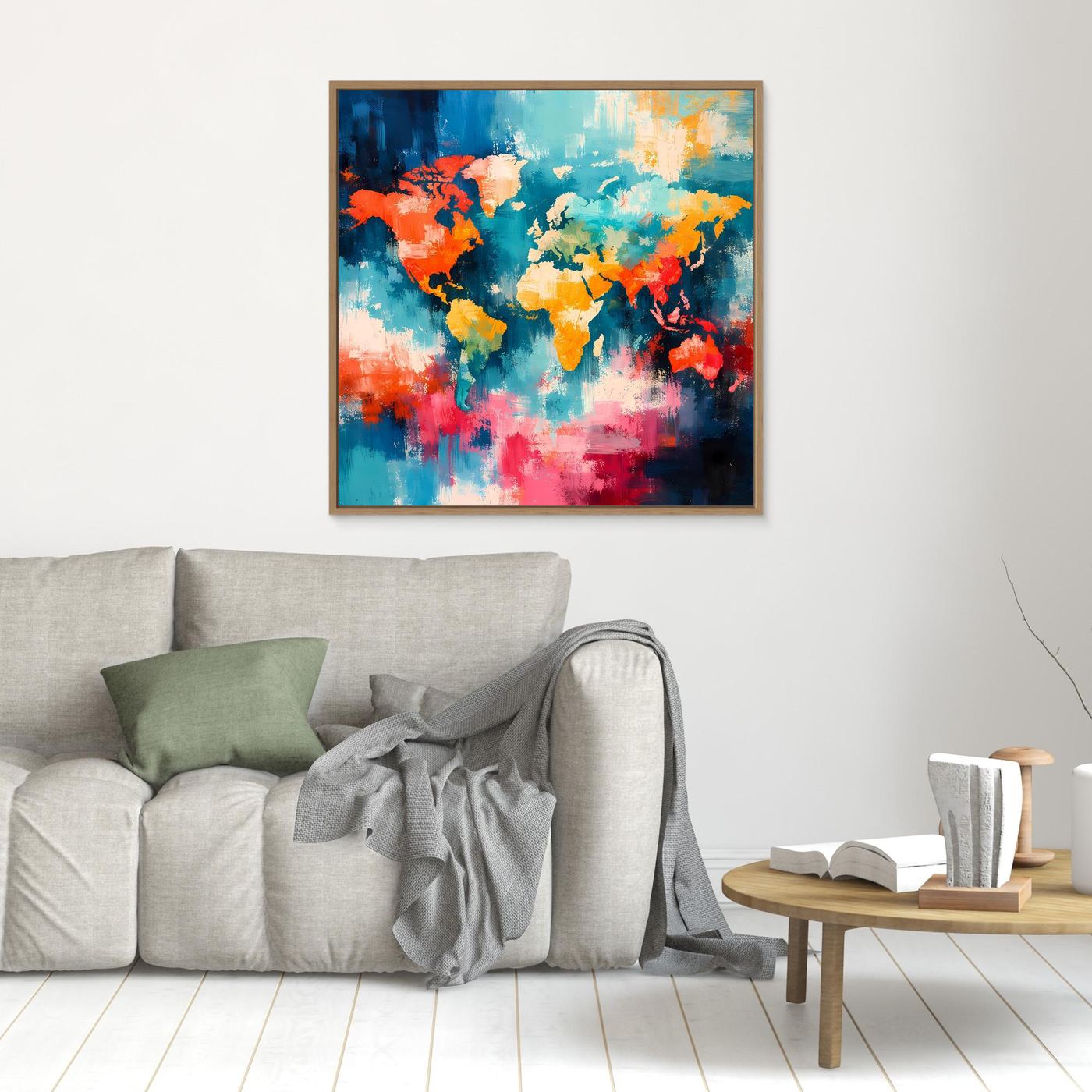Abstract world map canvas with colorful splash-style continents in an oak frame on wall